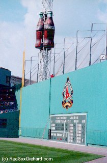Retrieving batting practice balls from atop the Green Monster