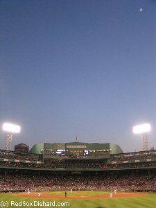The moon rises over Fenway