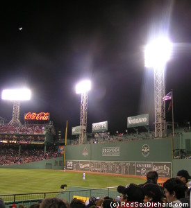 The moon rises over the Green Monster