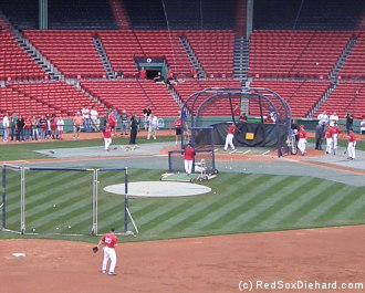 Kevin Youkilis fields ground balls at shortstop during batting practice as the Sox find themselves short-handed in the infield.