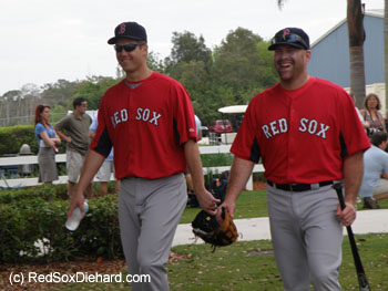 Jonathan Papelbon and Kevin Youkilis share a laugh on the way out to practice.