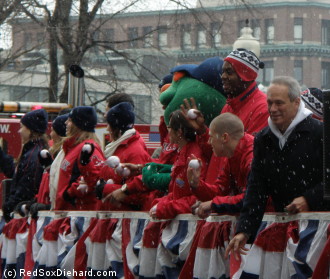 Larry Lucchino and the Fenway ambassadors tossed soft baseballs to the crowd through the falling snow as the equipment truck departed.