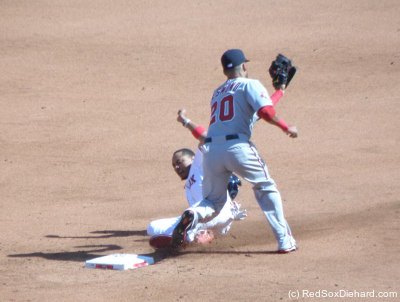 Opening Day hero Mookie Betts slides safely into second, but he didn't stop there, continuing on to take third too on the same play.