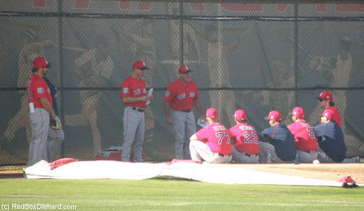The next activity for the catchers was Story Hour, apparently.  They all sat cross-legged on the ground and listened to bullpen coach Dana LeVangie, while Torey Lovullo and Jason Varitek looked on.