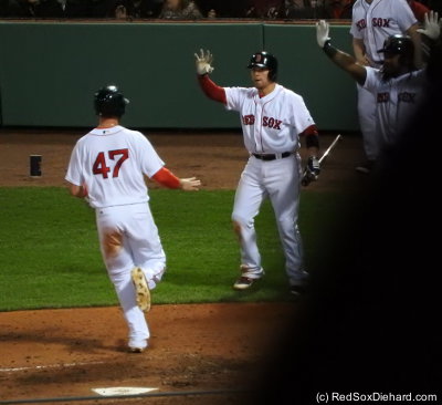 I normally wouldn't post a picture that was blocked by someone in front of me, but it's OK - the guy in the row in front of me got up and danced after all 14 of the Red Sox' runs scored. Christian Vazquez and Hanley Ramirez wave to Travis Shaw as he crosses the plate in the fourth... "Hi, Travis!" "Hey guys!"