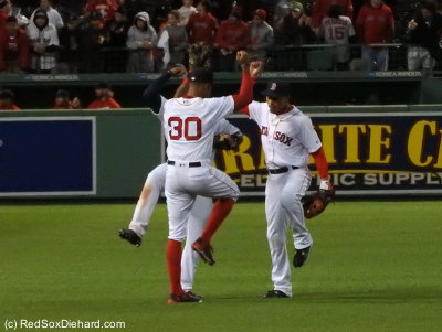 The game went into the books as a 14-7 win, and I got a good shot of the outfielders celebrating the vistory.