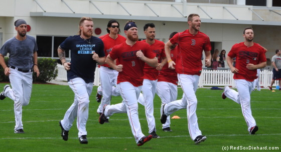 Left to right: Matt Barnes, Robbie Ross, Edgar Olmos, Craig Kimbrel, Joe Kelly, Chris Sale, and Tyler Thornburg were among the pitchers running sprints on the agility field.
