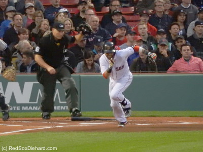 Dustin Pedroia sprints out of the box after hitting a ground ball in the first inning.