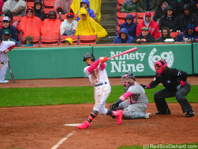 Mookie Betts takes a swing in the seventh. Even home plate ump Laz Diaz got into the Mother's Day spirit with a pink face mask.